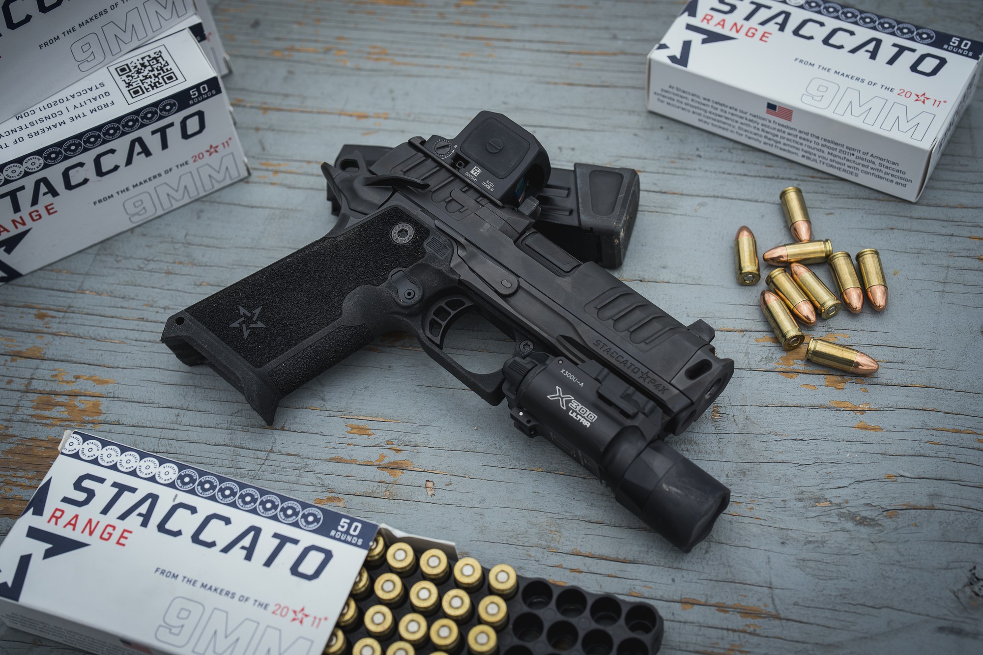 Staccato HD P4X with a weapon light and Staccato 9mm range ammunition